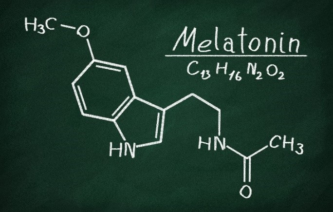 A drawing of the melatonin molecule on a chalkboard.