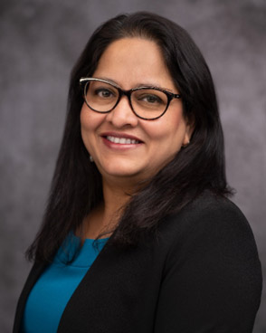 A headshot of Sudha Chakrapani