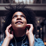 A girl listening to headphones.